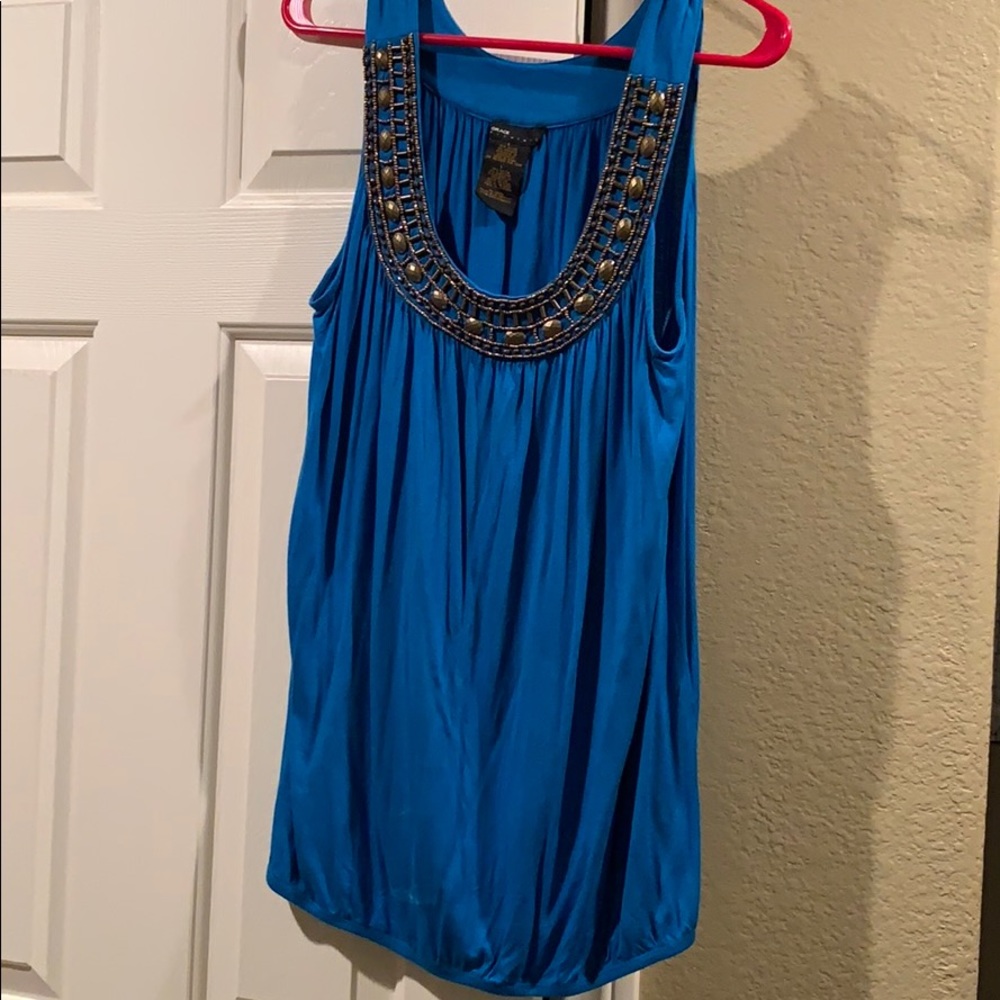 Blue tank top; gold detail neckline;sinched bottom